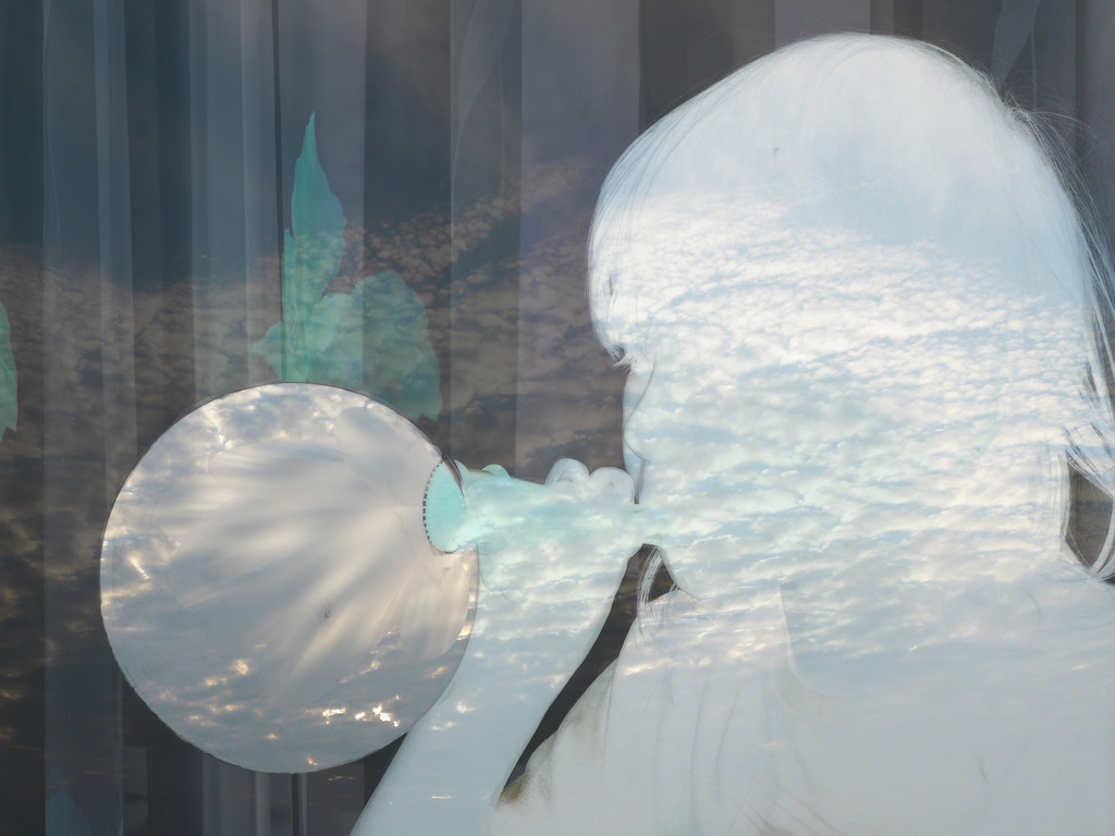 Blowing dreams in a soap bubble by etienne