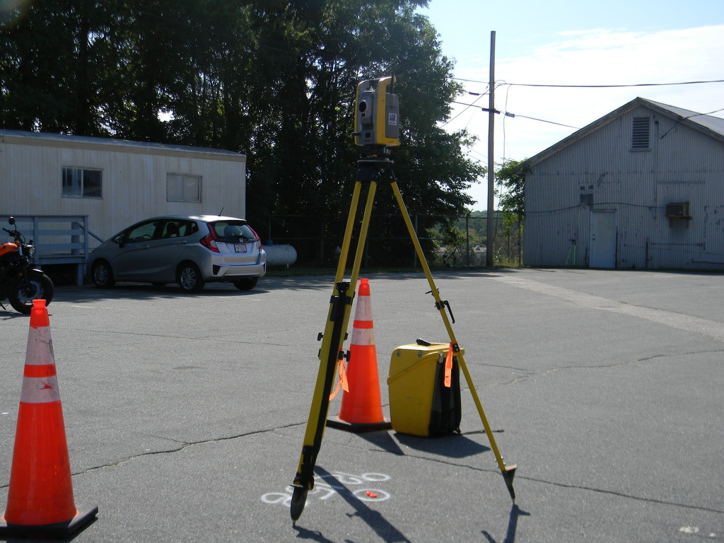 Surveying Equipment in Parking Lot by sfeldphotos