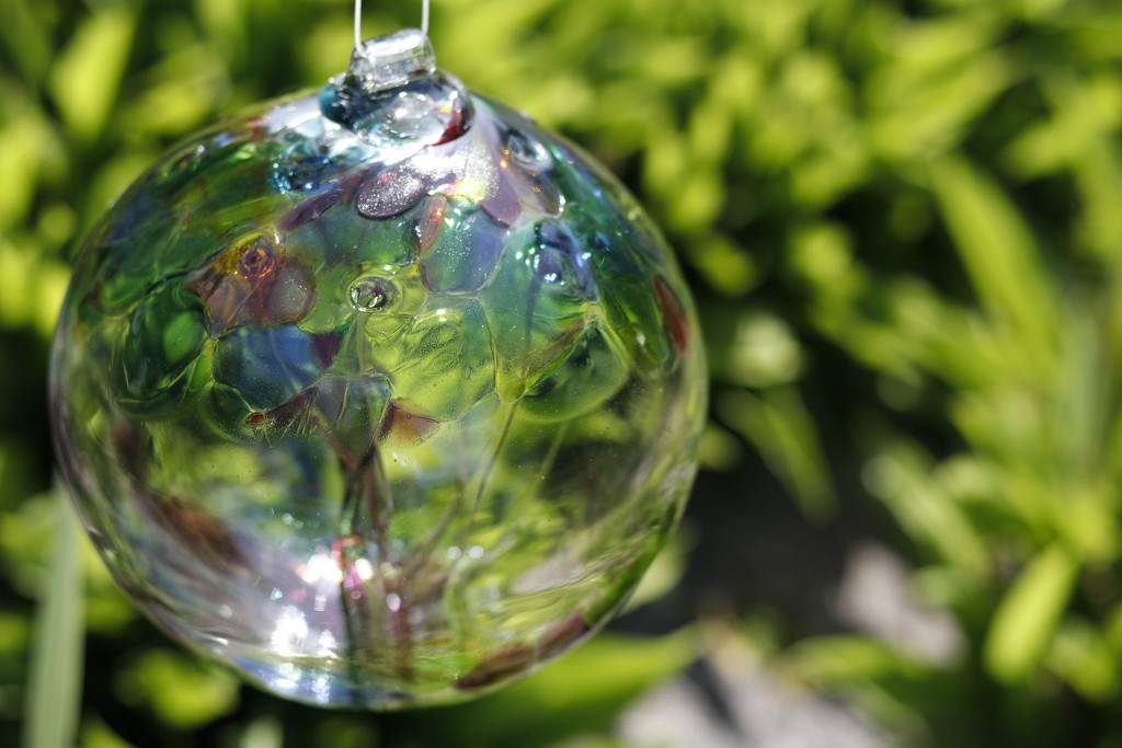 Glass globe in the garden by jdraper