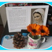 Prayers, a pine cone and white board. A vase of two calendula. by grace55