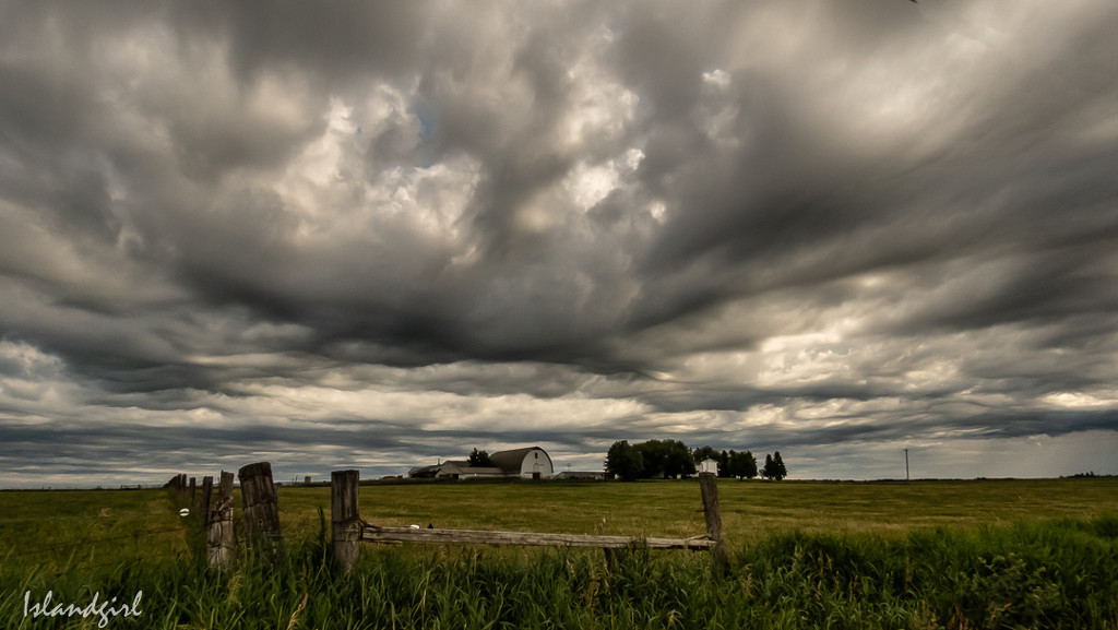 Clouds overlooking a Farm by radiogirl