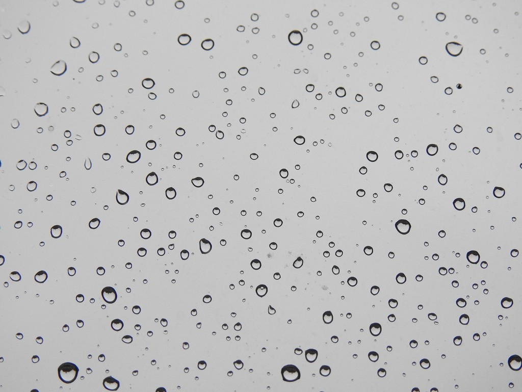 Raindrops on a window by roachling