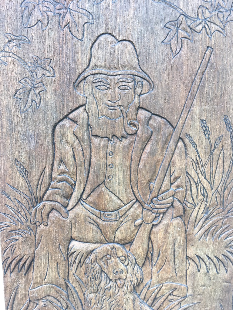Stopped at a pub for lunch today and this carving was by the door. Can you guess the name of the pub?! by 365anne