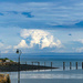 Nice clouds behind the old wooden pier by frequentframes