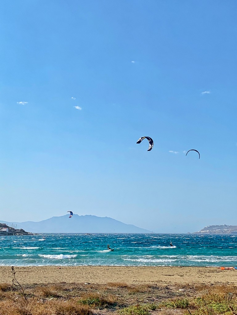 Three kite surfers.  by cocobella