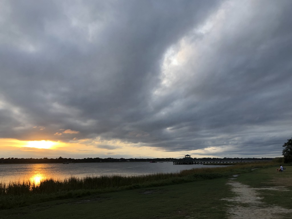 Sunset and clouds over the Ashley River at Brittlebank Park by congaree