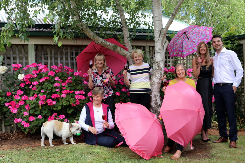 Brolly girls, pink geraniums and guests by gilbertwood