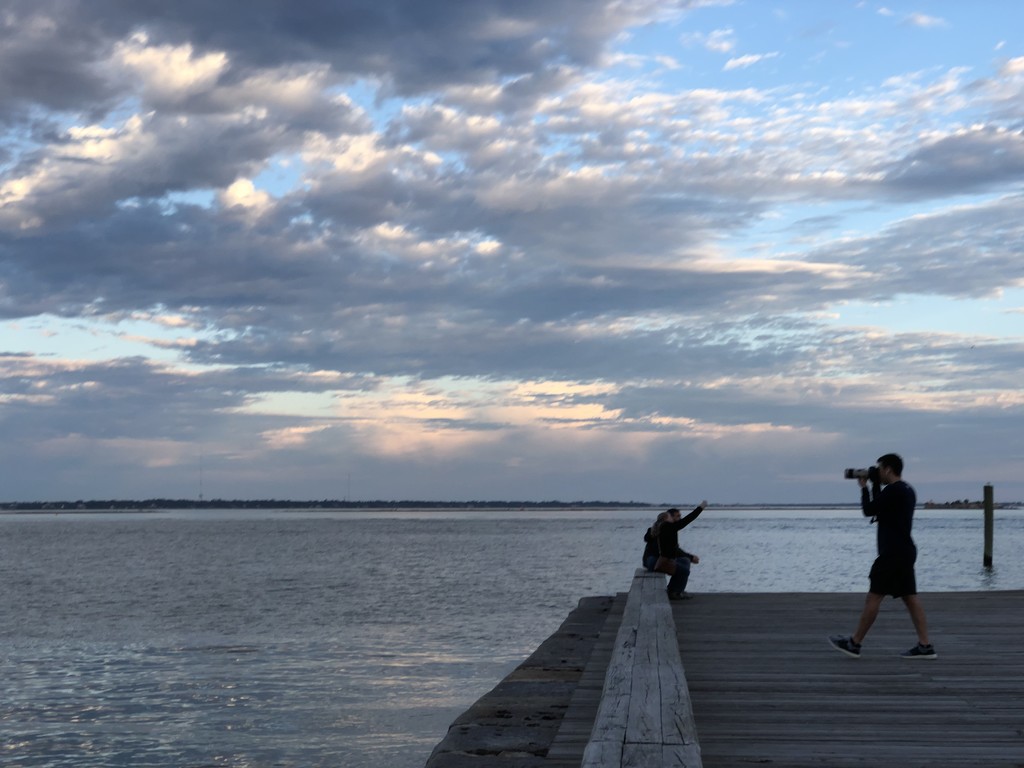 Photographers overlooking Charleston Harbor at Waterfront Park by congaree