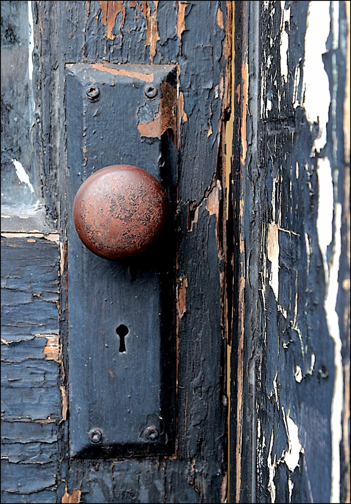 A Door Knob with Peeling Paint by olivetreeann