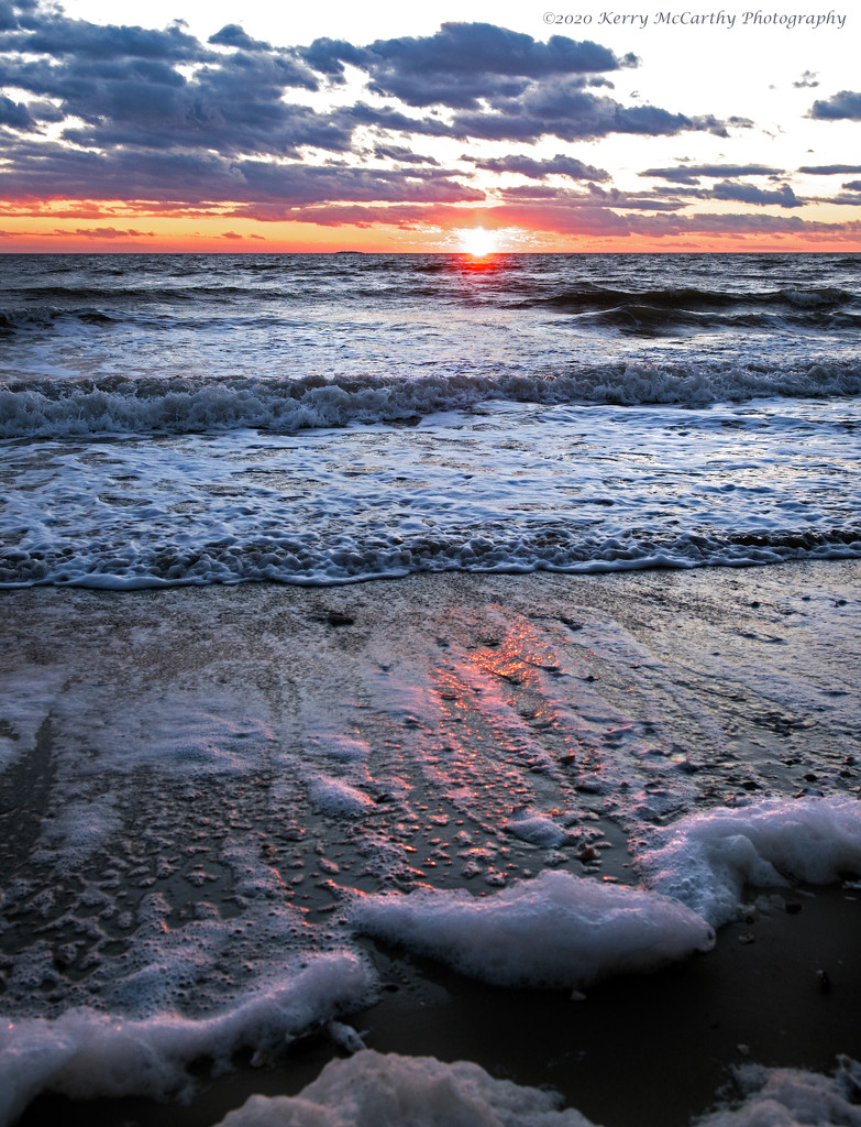 Sea foam at sunset by mccarth1