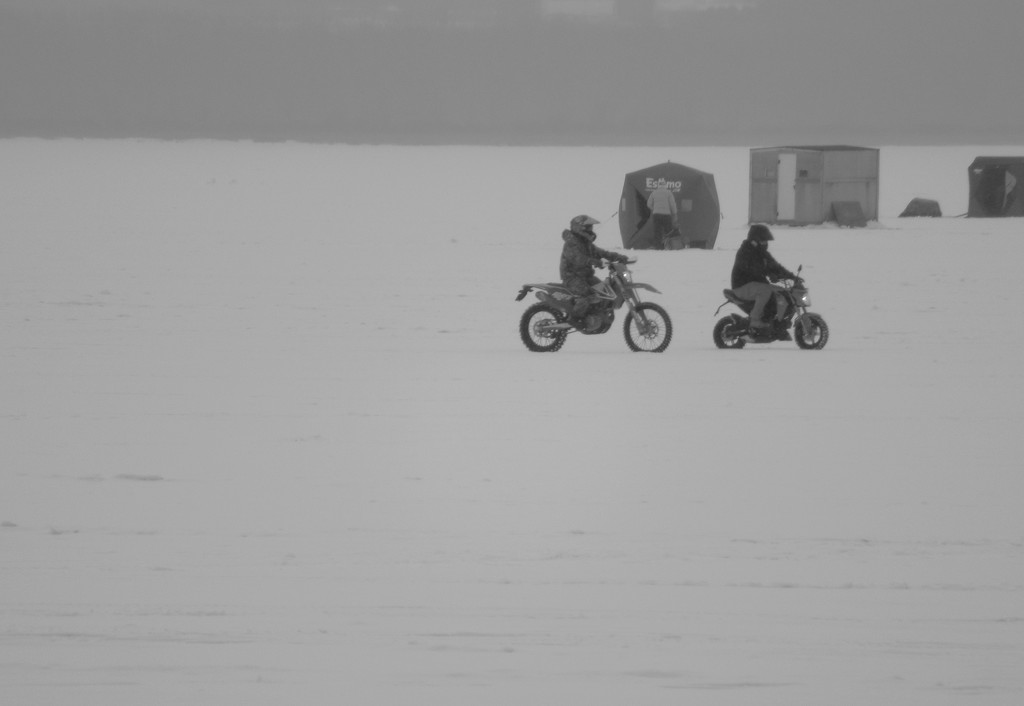 Fish huts snowmobiles trucks and bikes  by bruni
