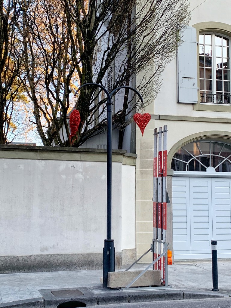 Two tiny red hearts in Morges.  by cocobella