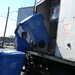 Putting Recycling Bin in Truck by sfeldphotos