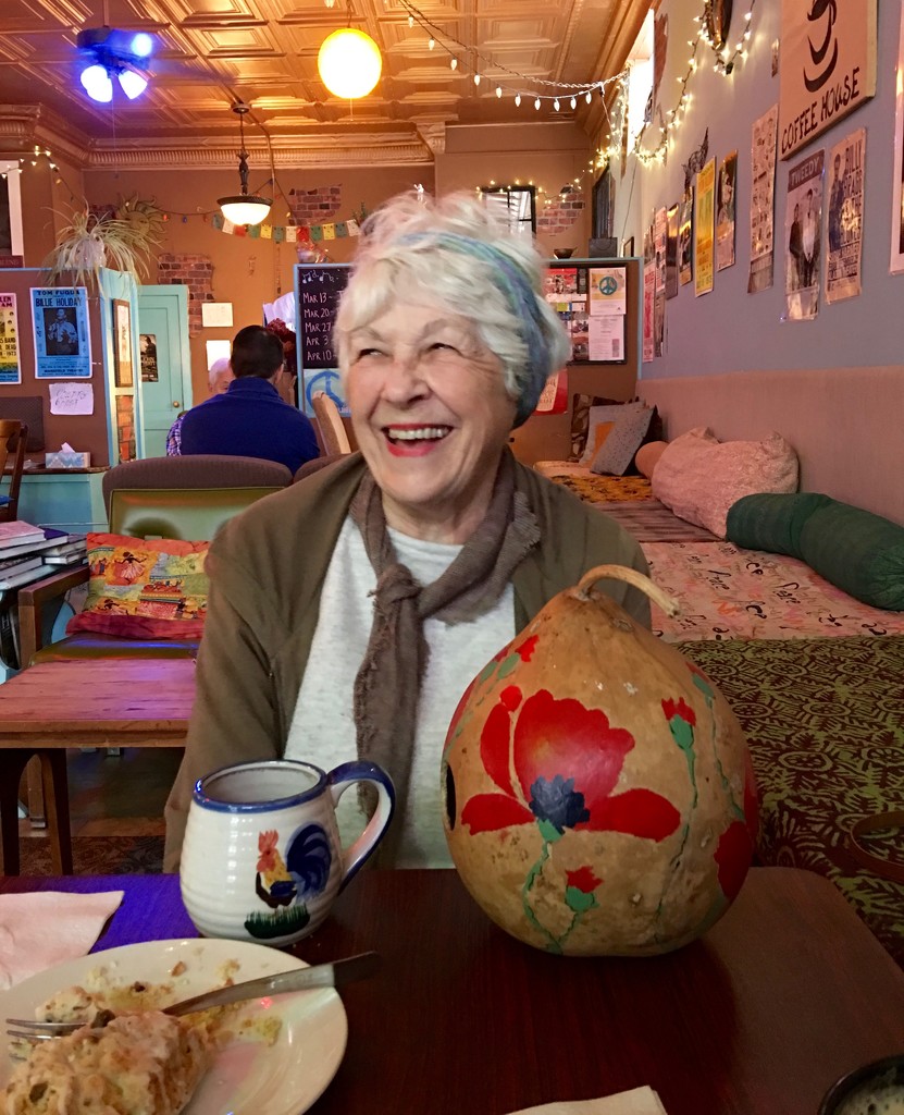 My friend, Jo, with the gourd she grew and painted by essiesue