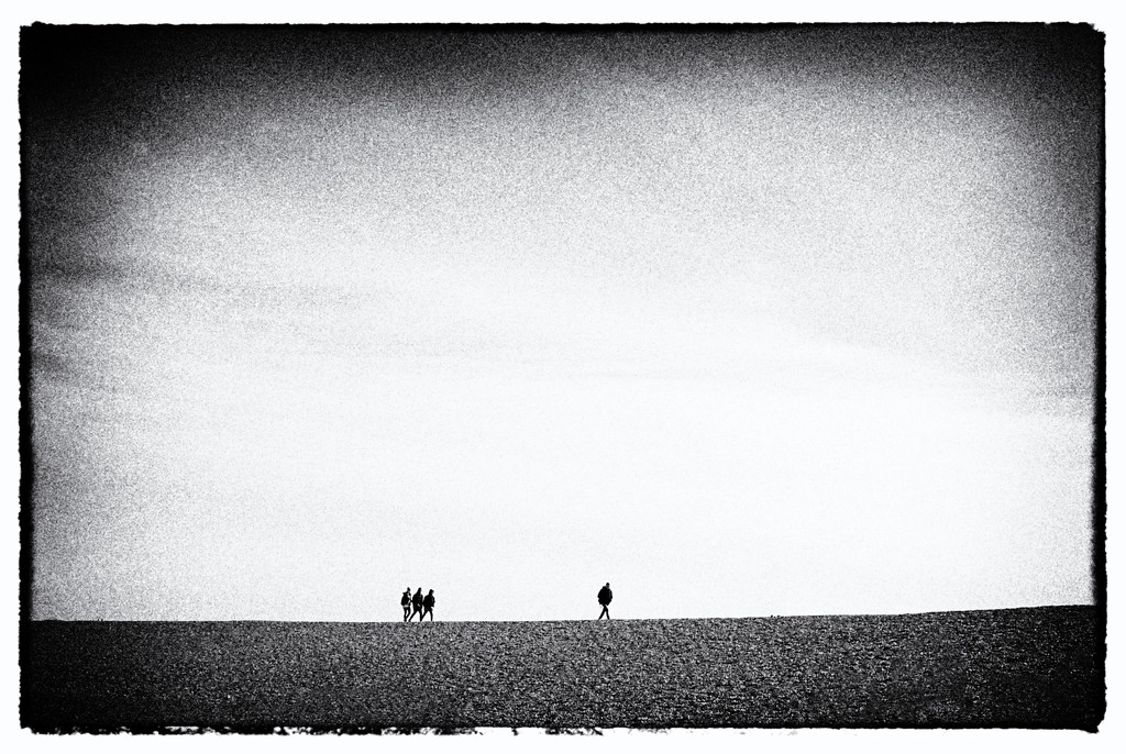 Four figures on Folkestone Beach by seanoneill