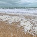 Foam on the beach.  by cocobella