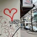 Red heart on a wall.  by cocobella