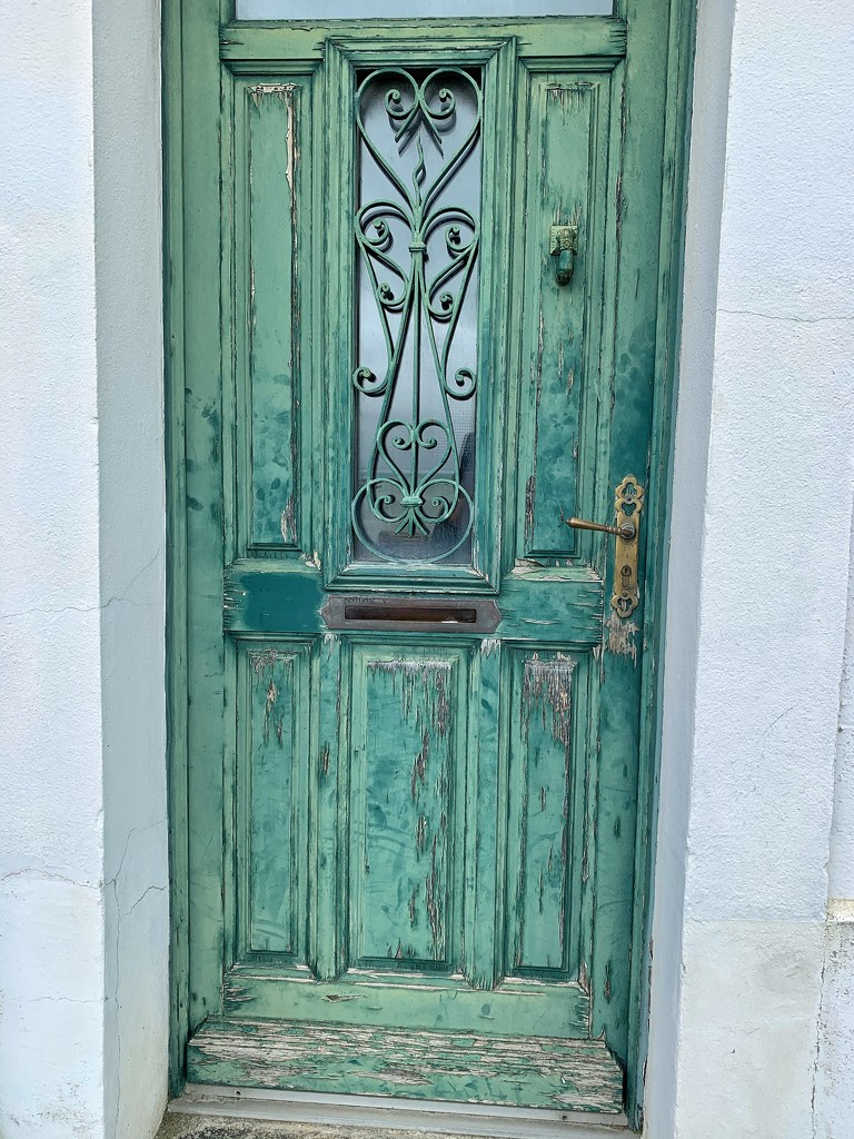 4 hearts on a green door.  by cocobella