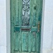 4 hearts on a green door.  by cocobella