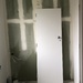 Door in incomplete bathroom  by brigette