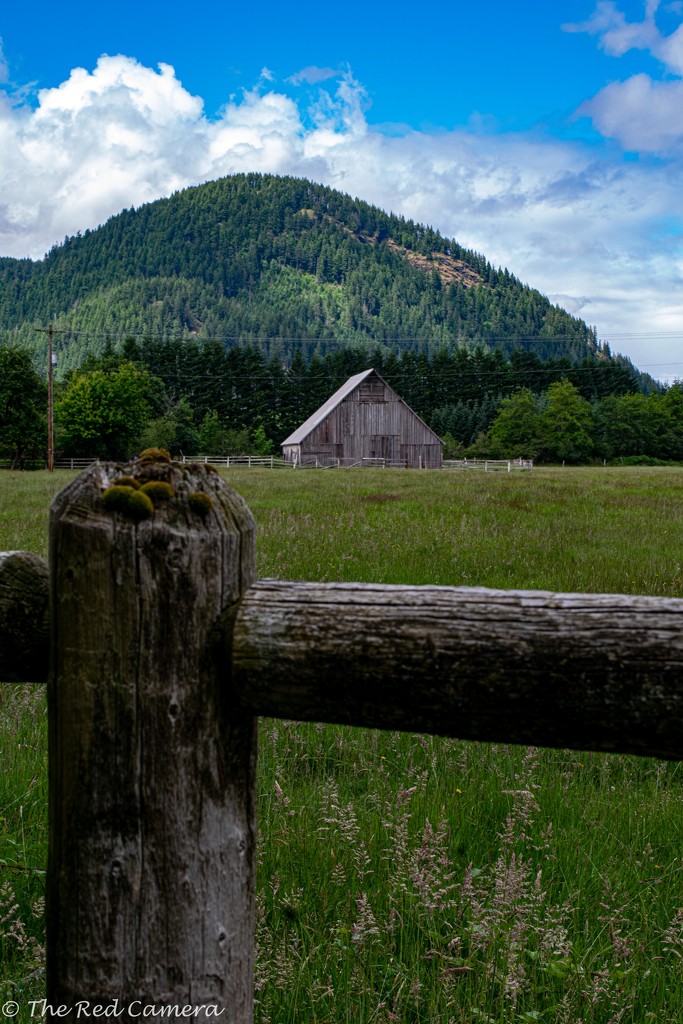 Post and Rail with barn by theredcamera