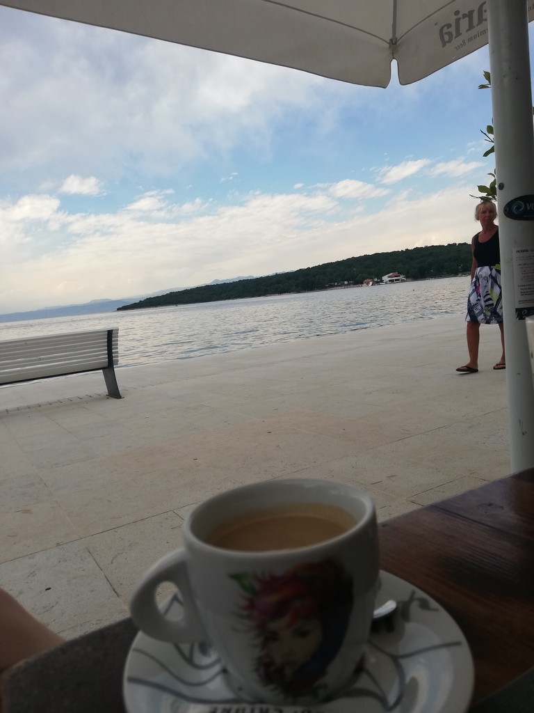 Trying to take a picture of my coffee and the sea by nami