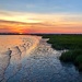 Sunset over the marsh at low tide, Ashley River at Charleston by congaree