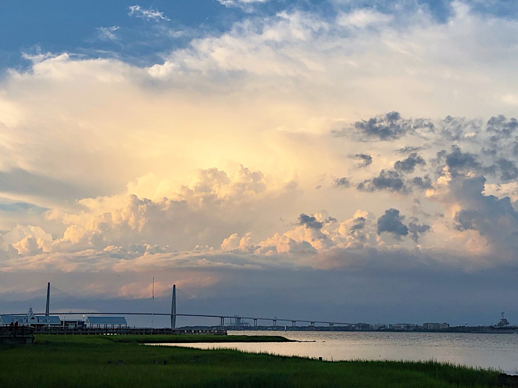 Clouds and golden light over Charleston Harbor by congaree
