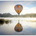 Balloon over lake by julzmaioro