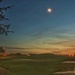 Moon following the setting sun.  by joesweet