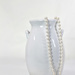 white vase and pearls by summerfield
