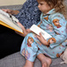 Clutching the bookmark for Wimpy Kid by rhoing