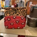 Pink hearts on red bag.  by cocobella