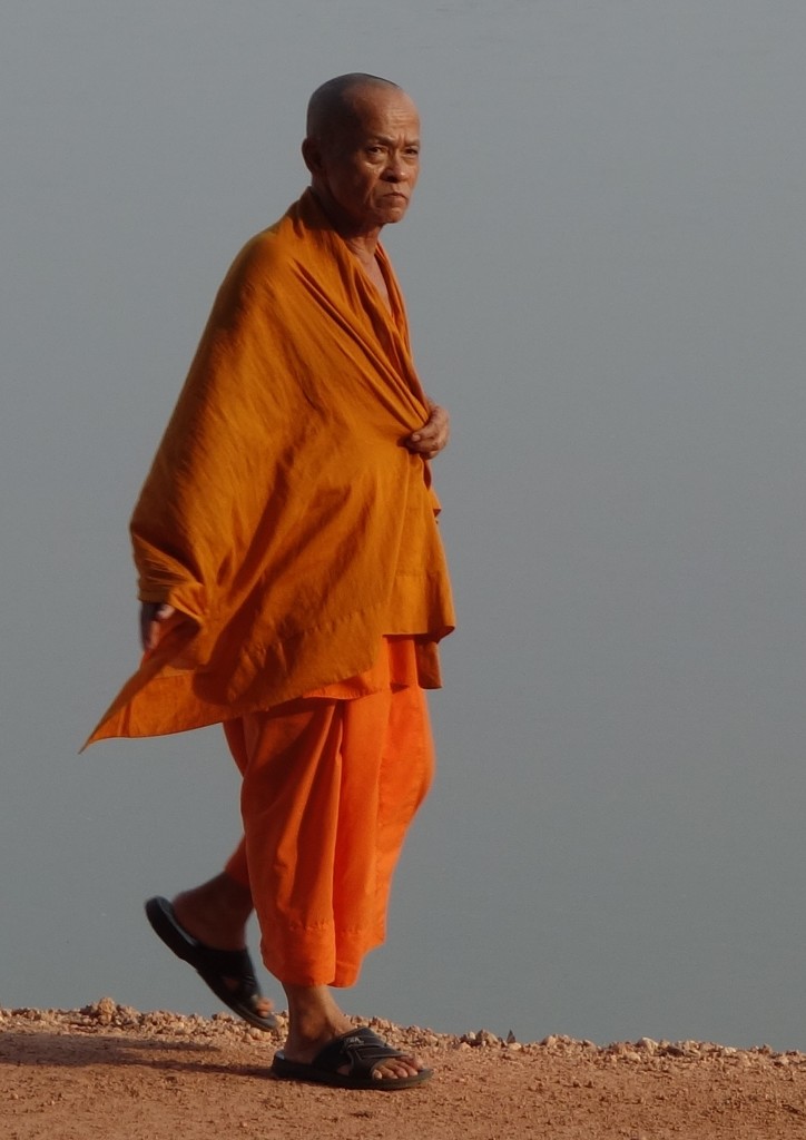 Buddhist monk alongside Mekong River, Vientiane, Laos.  by johnfalconer
