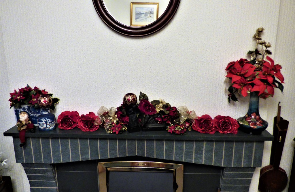 The fireplace  all decorated for Christmas by beryl