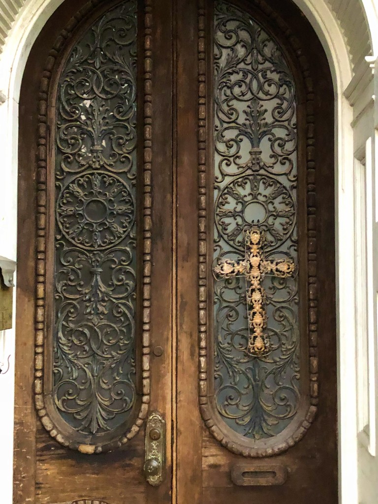 Intricate door with cross, historic district, Charleston by congaree
