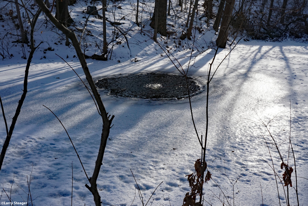 Frozen pond with air pump by larrysphotos