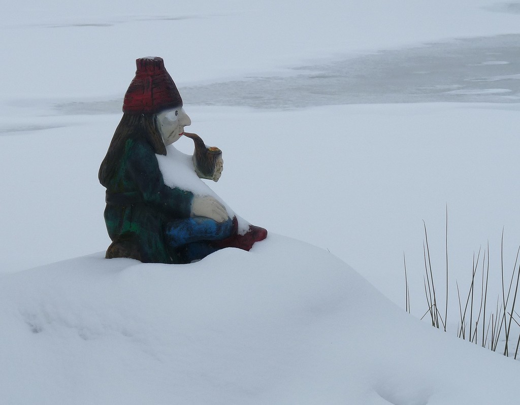Vodník sitting on the shore of a snowy pond. by kclaire