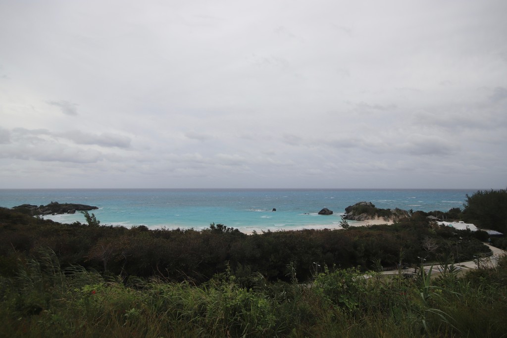 Empty beach on a rainy day by lisasavill