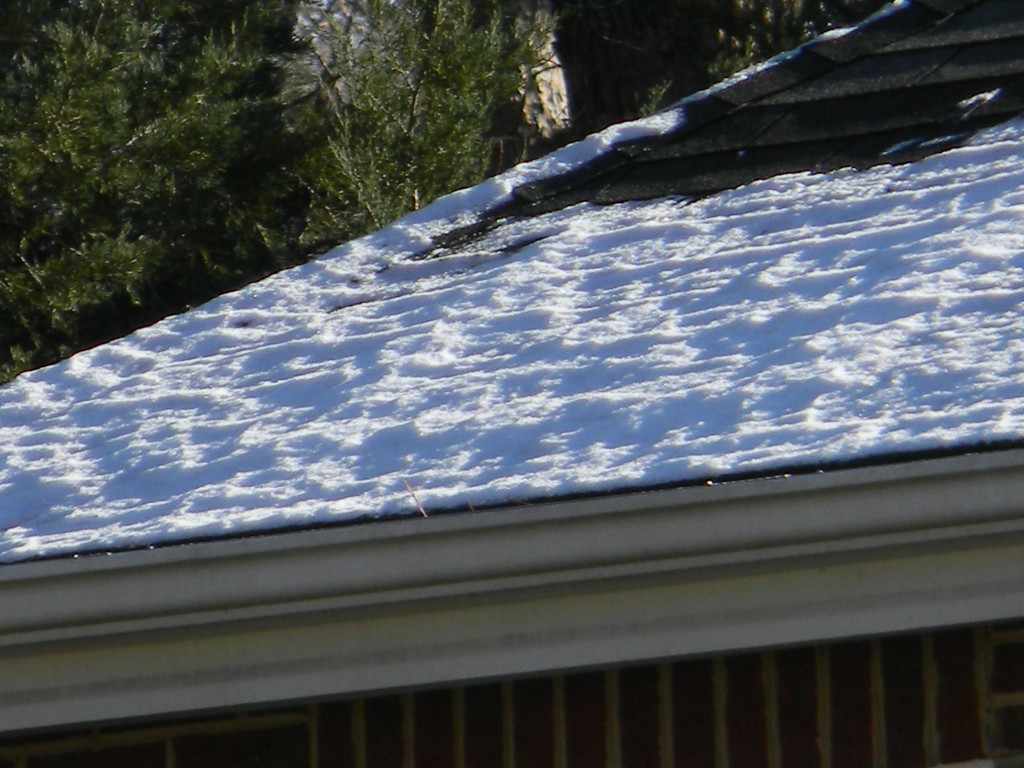 Snow on Neighbors' Roof by sfeldphotos