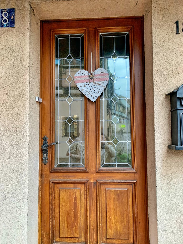 White heart on brown door.  by cocobella