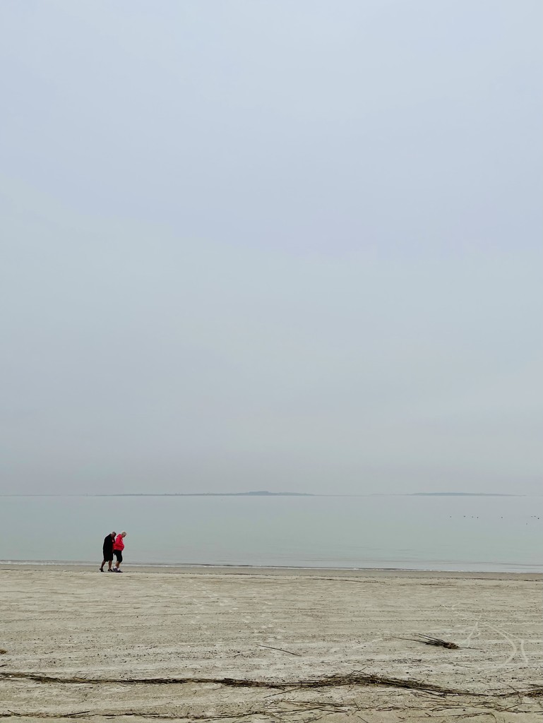 2 people on the beach.  by clayt