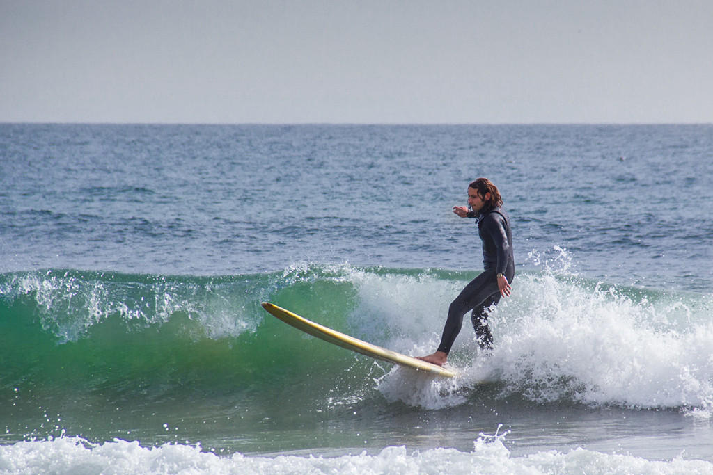 Surfer at Topanga Beach by jaybutterfield