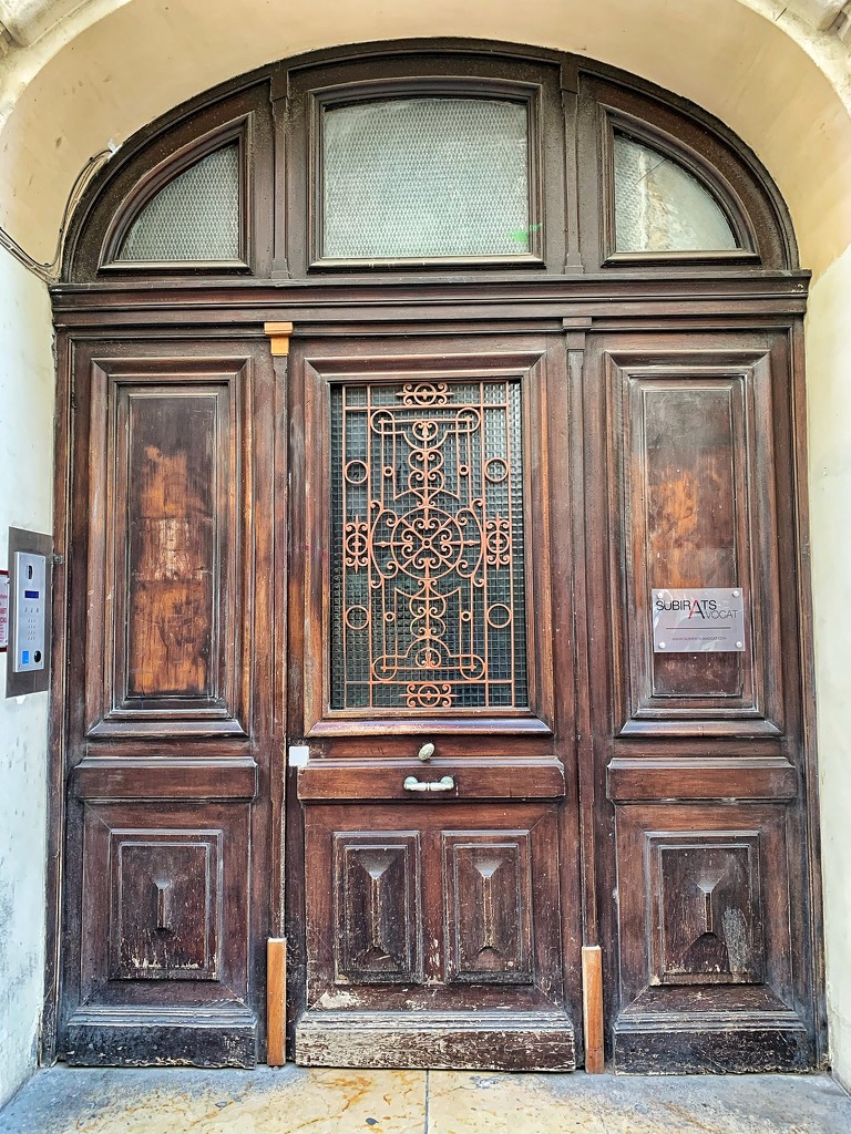 Hearts on a big brown door.  by cocobella