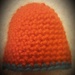 A little orange crocheted hat. by grace55