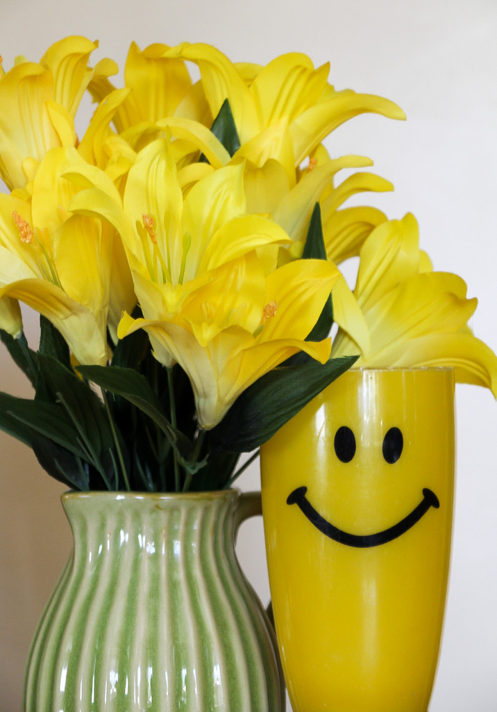 Yellow Smiley Cup and flowers by mittens