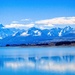 Blue skies reflected in Lake Tekapo by kiwinanna