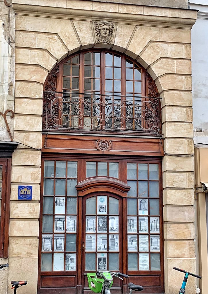 Balcony with hearts above a big door.  by cocobella