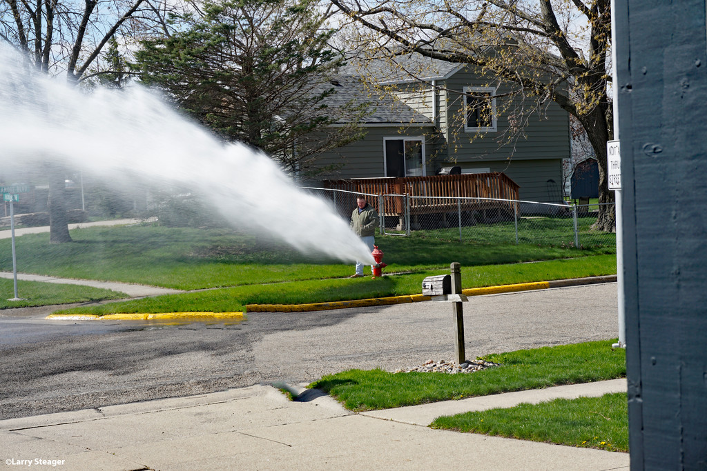 Flushing the fire hydrant by larrysphotos