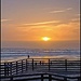 Setting sun at Pismo Beach by madamelucy